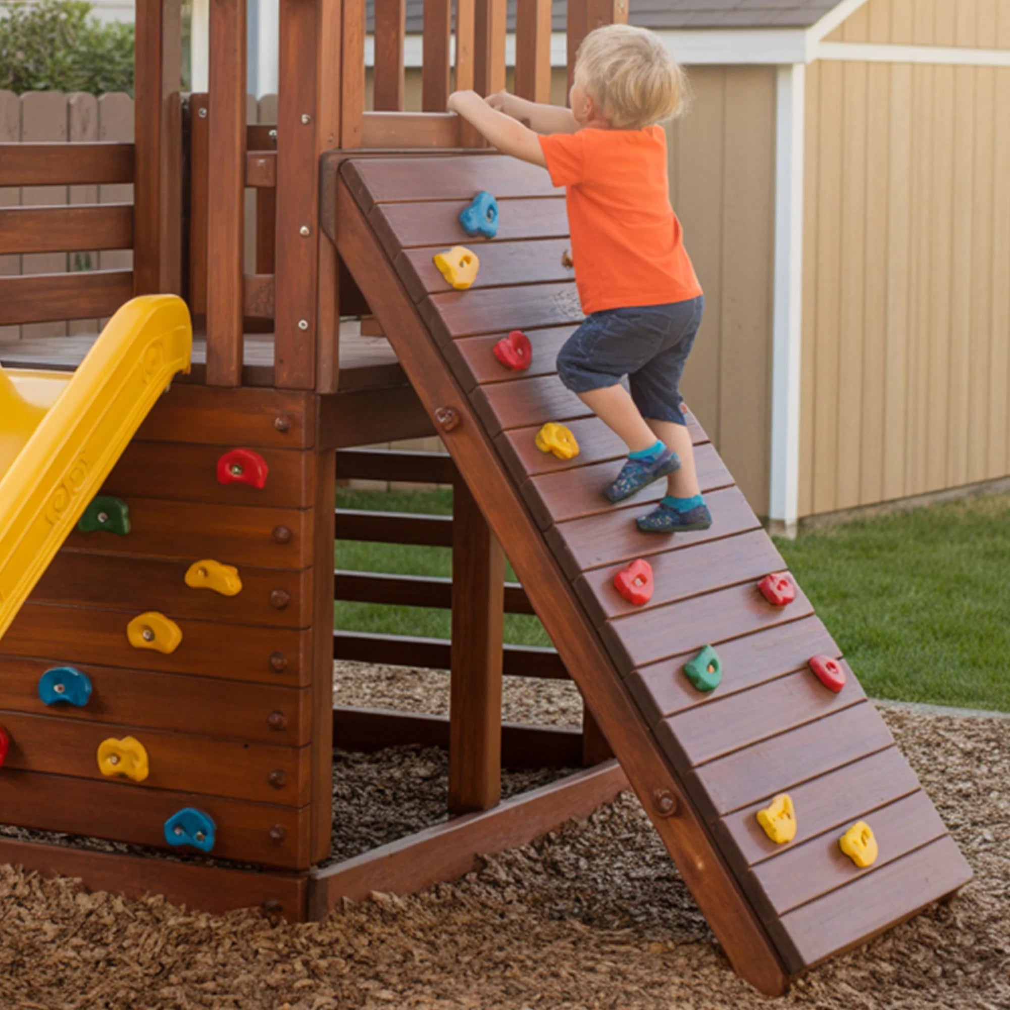 Compact Wooden Playset with Yellow Slide & Rock Climbing Wall – Backyard Fun for Kids | 10x10x9 ft